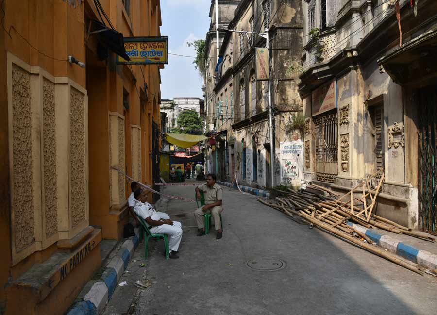 Policemen posted at Madan Dutta lane in Bowbazar where several houses developed cracks following tunnelling work on the East-West Metro corridor
