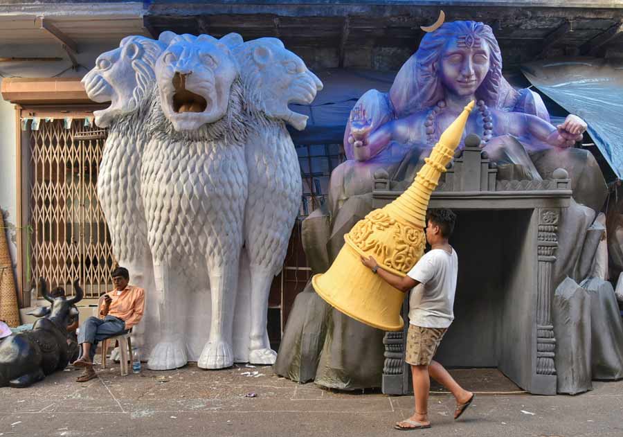 Massive pandal props, including the National emblem etc, being assembled on Friday.