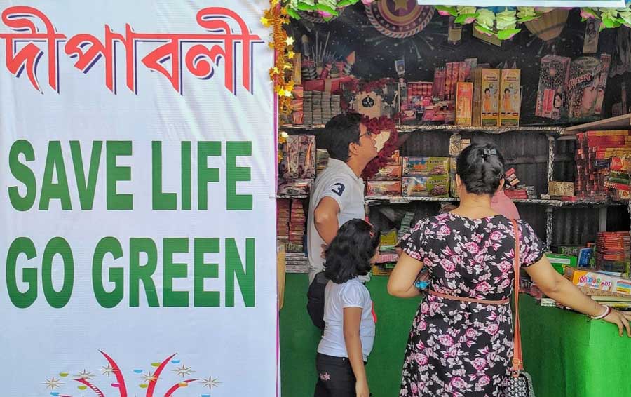 Buyers throng a stall selling green fireworks at Tala Park Baji Bazar on Saturday