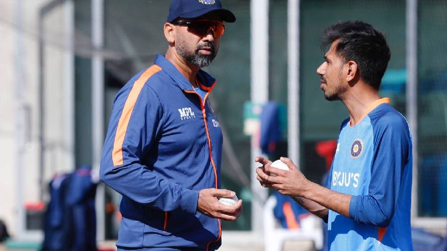 Yuzvendra Chahal with bowling coach Paras Mhambrey