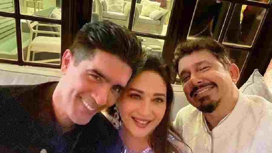 Bollywood's dancing queen, Madhuri Dixit poses with fashion designer Manish Malhotra. 