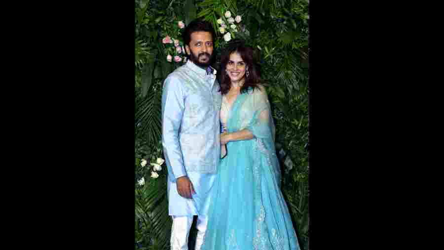 Riteish Deshmukh and Genelia Deshmukh twinning in blue attire during the Diwali bash of actor Kriti Sanon, in Mumbai. 
