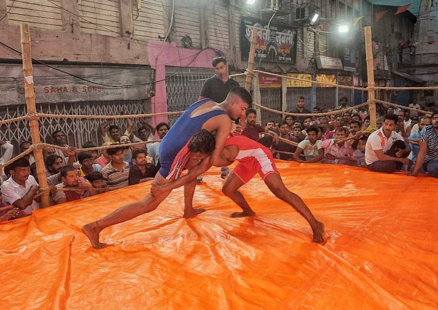 Wrestlers compete at a pre-Diwali annual event in Burrabazar on Sunday