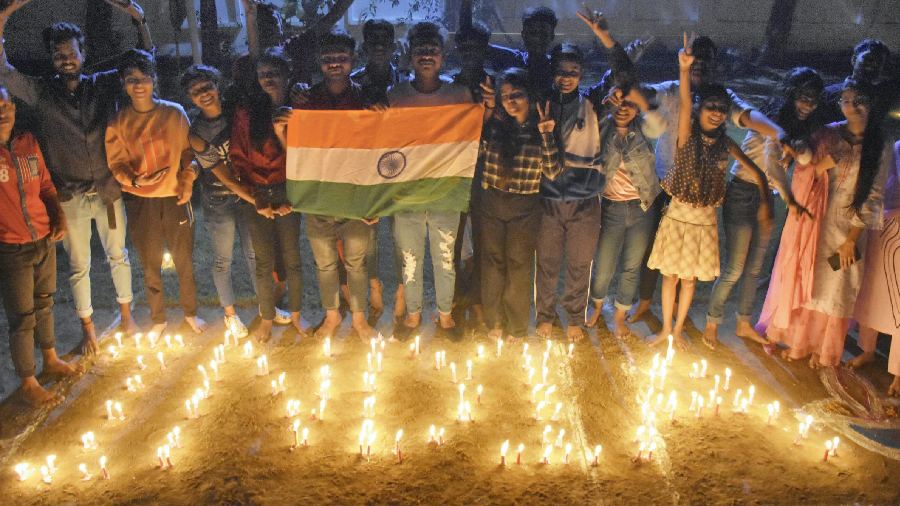People light candles to celebrate after India won the ICC Men's T20 World Cup cricket match against Pakistan, on the eve of the Diwali festival, in Moradabad on October 23.  