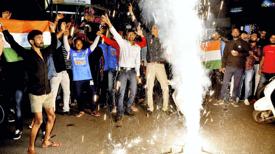 People celebrate after India won the ICC Men's T20 World Cup cricket match against Pakistan, in Ranchi, on October 23. 