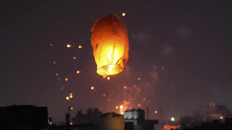 A lantern being released into the sky during the celebrations, in New Delhi