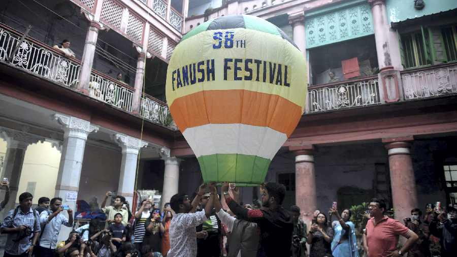 People release a hot air balloon as part of the celebrations, in Calcutta