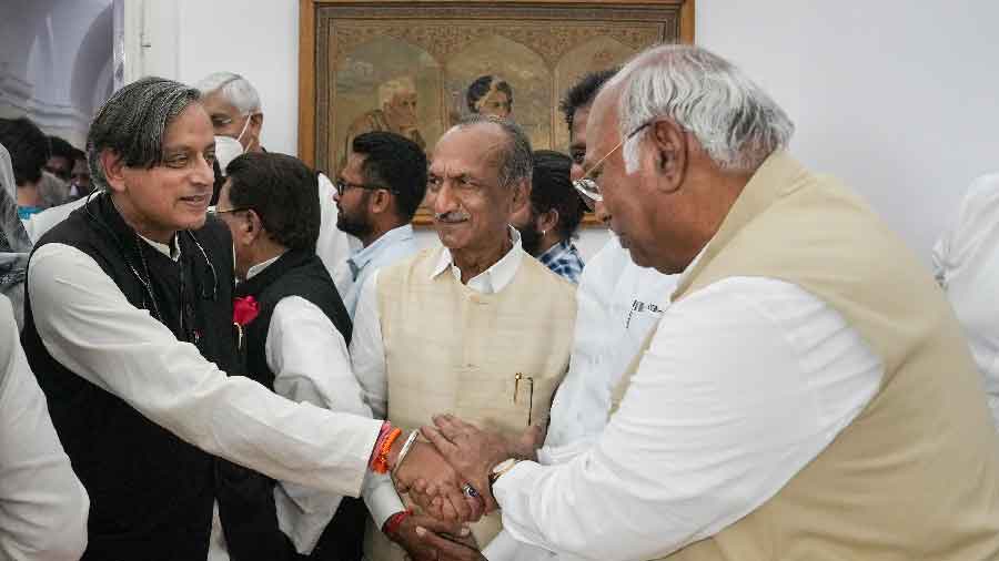 Shashi Tharoor (left) greets Kharge. Tharoor contested against the Karnataka veteran in the race to the Congress chief post
