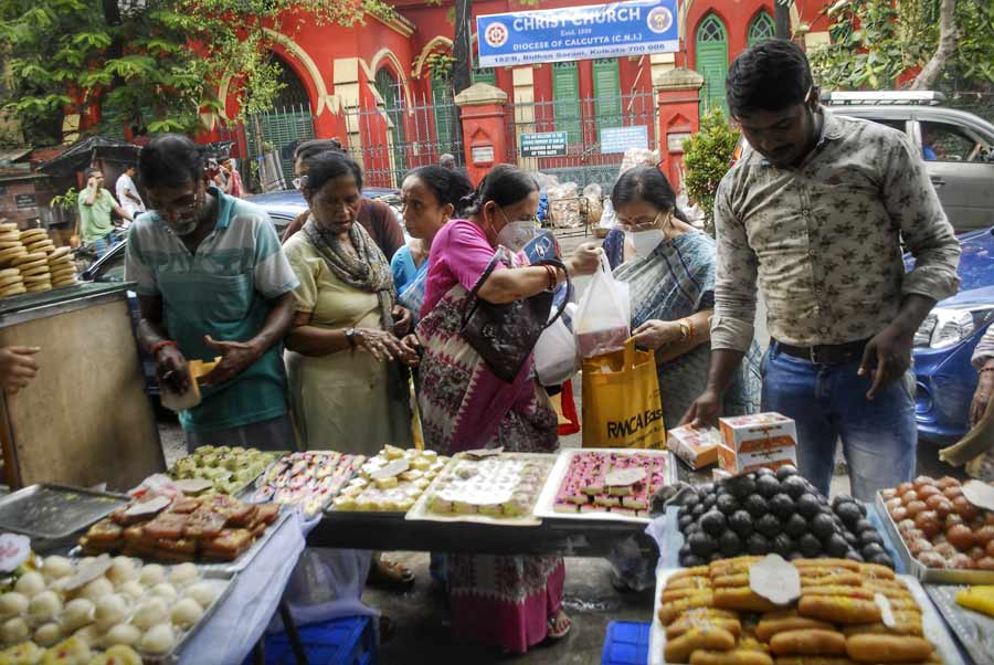People throng sweet shops on the occasion of Bhai Dooj and Bhai Phonta on Wednesday