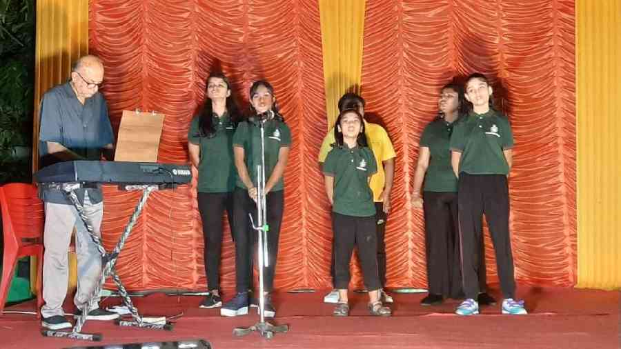 The choir performs at a programme during the festive season. Raichaudhuri is on the synthesizer