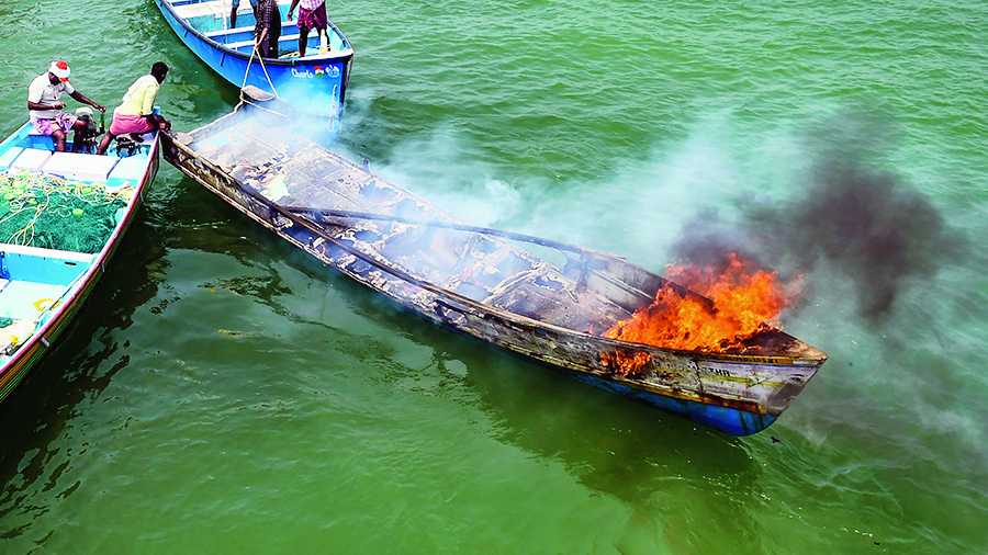 The boat on fire during the protest on Thursday.  