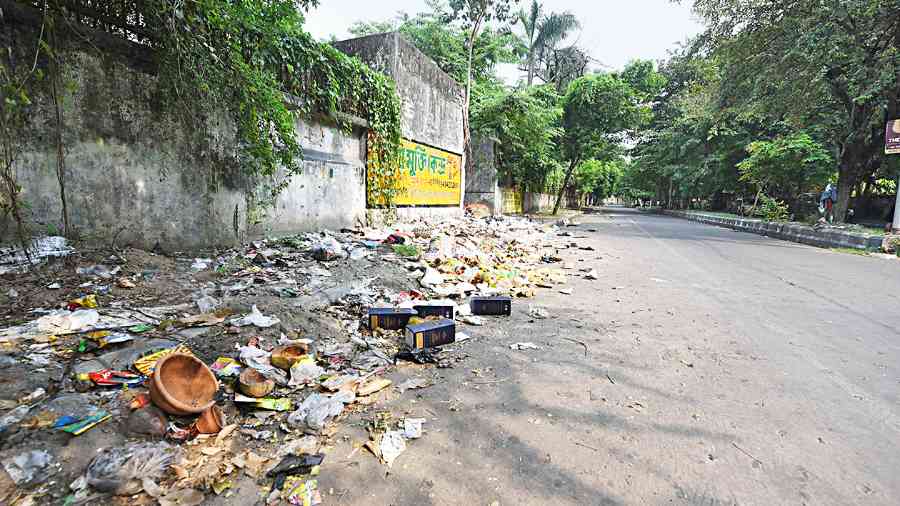 Garbage strewn along the road near AMRI Hospitals in Salt Lake on Thursday. 