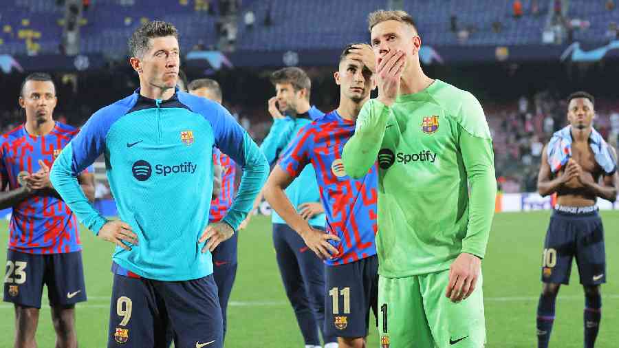 Robert Lewandowski (left), Ferran Torres and goalkeeper Marc-Andre ter Stegen look dejected after Barcelona’s loss to Bayern Munich on Wednesday. 
