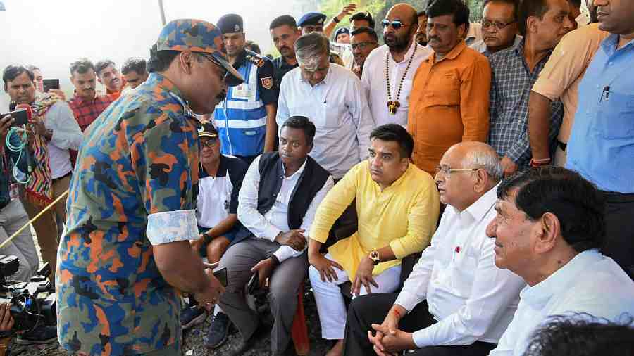 Bhupendra Patel with Gujarat Home Minister Harsh Sanghavi and others during a press conference 