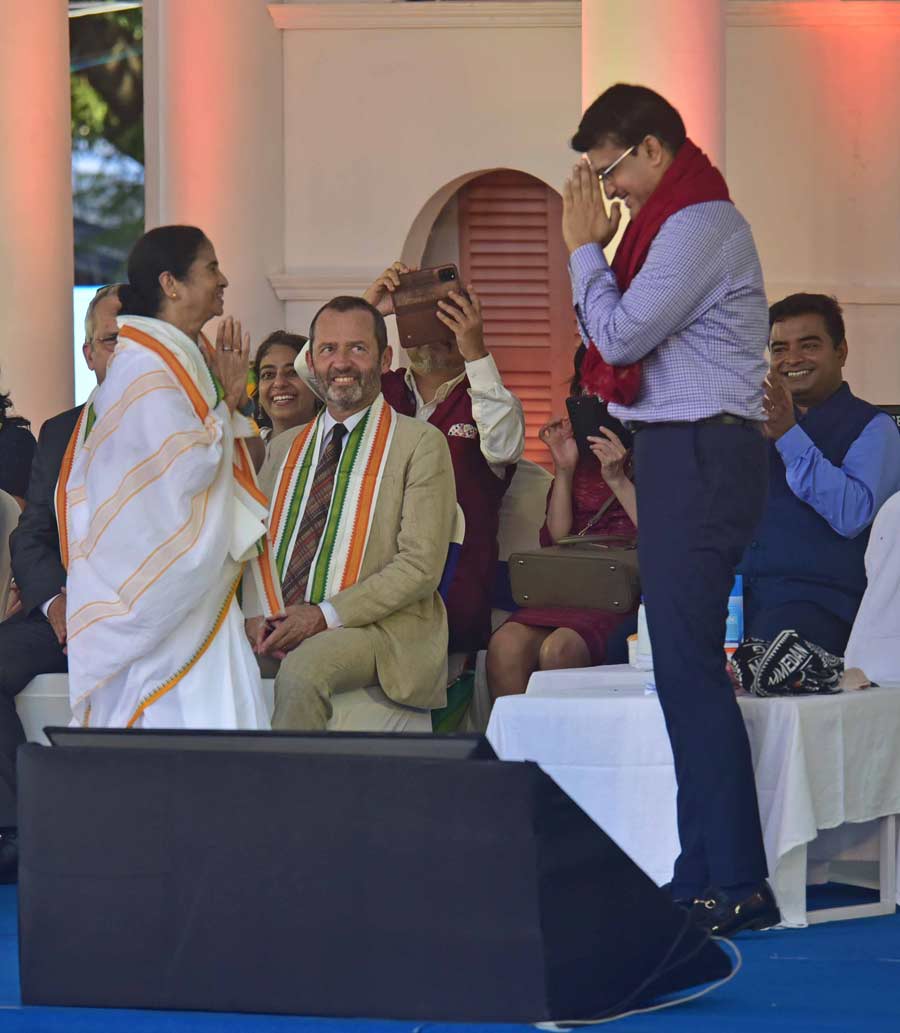 Chief minister Mamata Banerjee and BCCI president Sourav Ganguly greet each other.