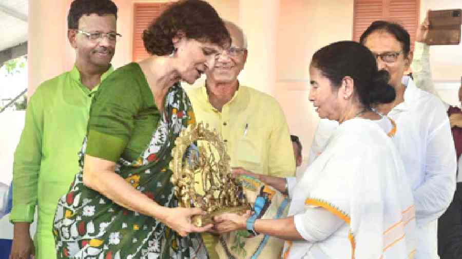 Chief minister Mamata Banerjee felicitates Tapati Guha Thakurta on Thursday