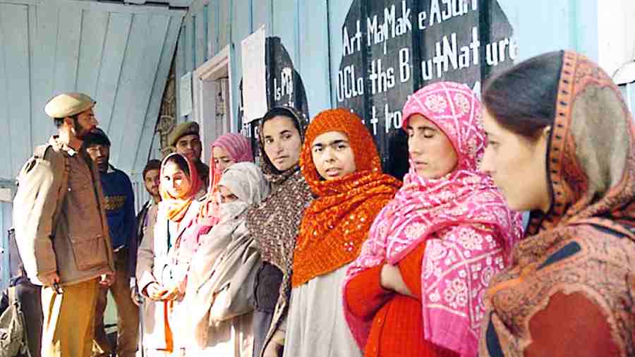 Voters wait in a queue at a polling station in Kupwara during the 2008 J&K assembly elections