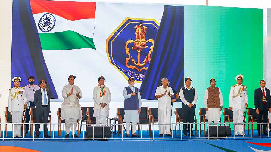 Indian Navy switched to a new ensign, as seen in the background, during the launch of the carrier