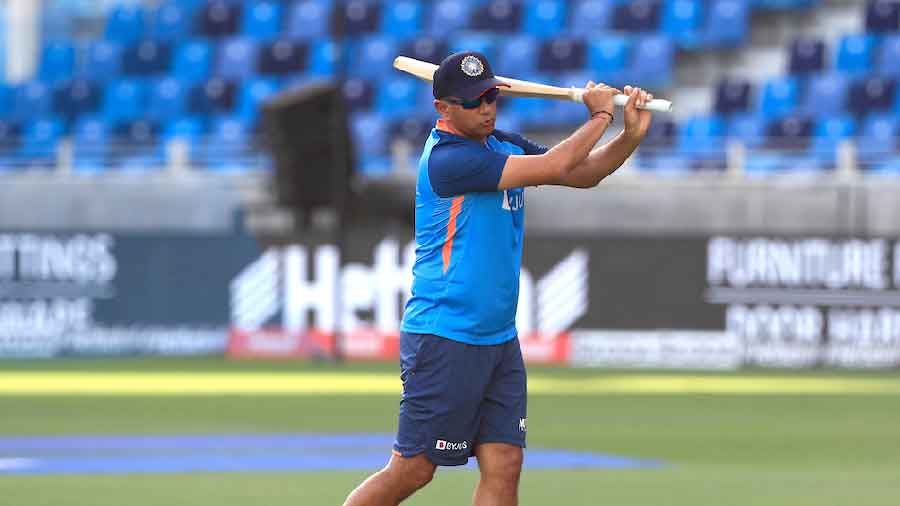 Coach Rahul Dravid wields the willow