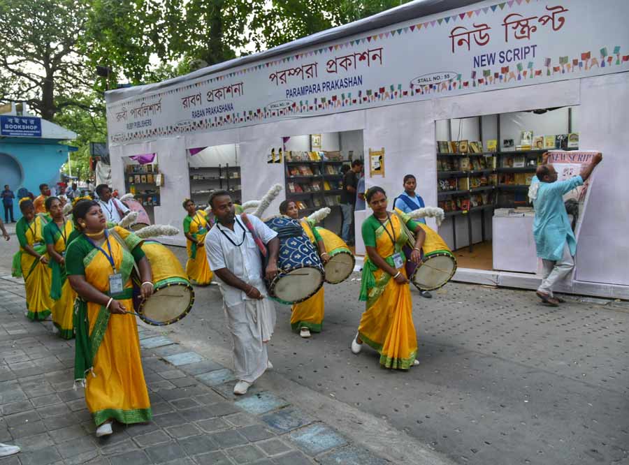 Men and women dressed in traditional attire play the dhak at a book fair on the premises of Paschimbanga Bangla Akademi on Friday. The 10-day ‘Sharad Boi-Parbon’ will continue till September 11. Bibliophiles can visit the fair between 2pm and 8pm.