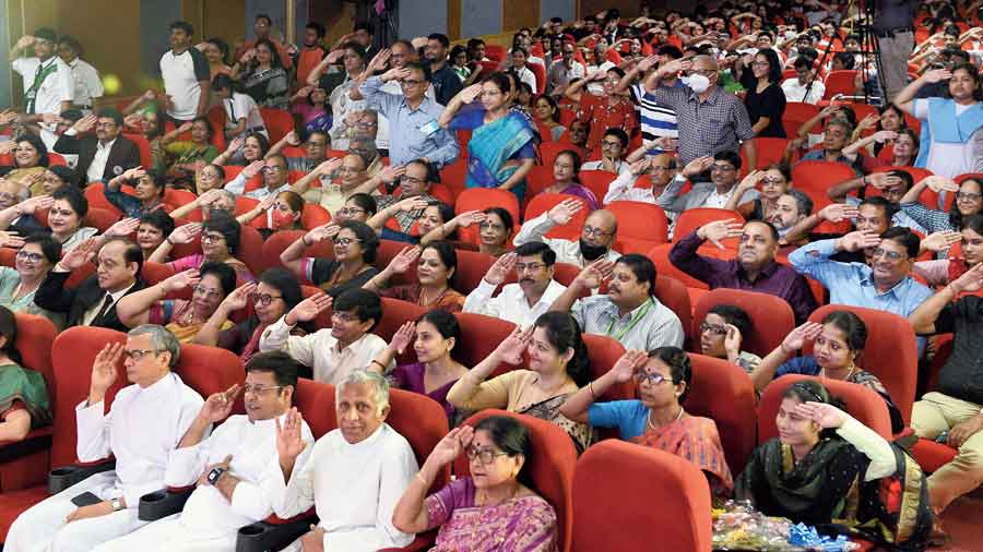 The audience saluted Sergeant Prakash Ghosh in appreciation. In the second row, extreme right, is Renu Khatun, saluting with her left hand. Her right hand chopped off, allegedly by her husband, Renu refused to yield to despair and now has a job in the state health department.