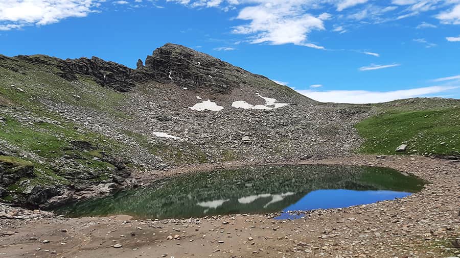 A first look at the Bhrigu Lake at an altitude of over 14,000ft. The water is clear and still, and one can see the bottom of the lake. It’s forbidden to wear shoes near the lake. Our entire team of mostly first-time trekkers made it to the top
