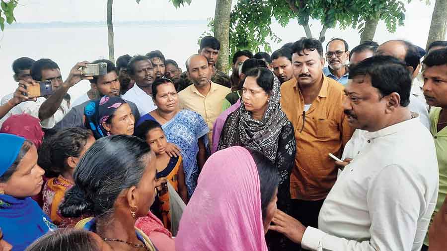 Ministers Partha Bhowmick and Sabina Yeasmin meet Jalpaiguri villagers on Sunday. 