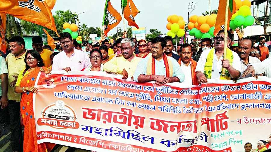 Sukanta Majumdar and other BJP functionaries lead the march at Tufanganj on Monday.