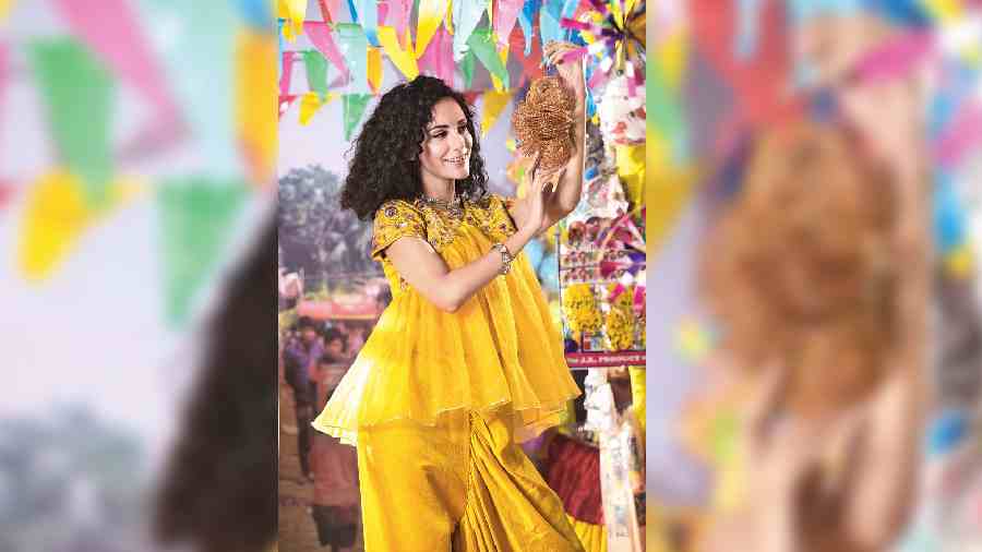 Yellow spells happy and this peplum top with dhoti pants has cheer written all over it.