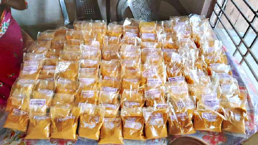 Packets of turmeric powder at the office of the self-help group