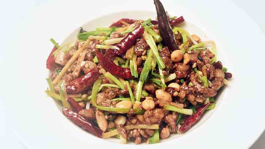 Minced Pork Sichuan Style is a delight for pork lovers. This has  fried peanuts and lip-numbing crunchy Sichuan peppercorn and a gamut of rich flavours. Chicken and vegetarian versions of Spinach and Water Chestnuts are also available.