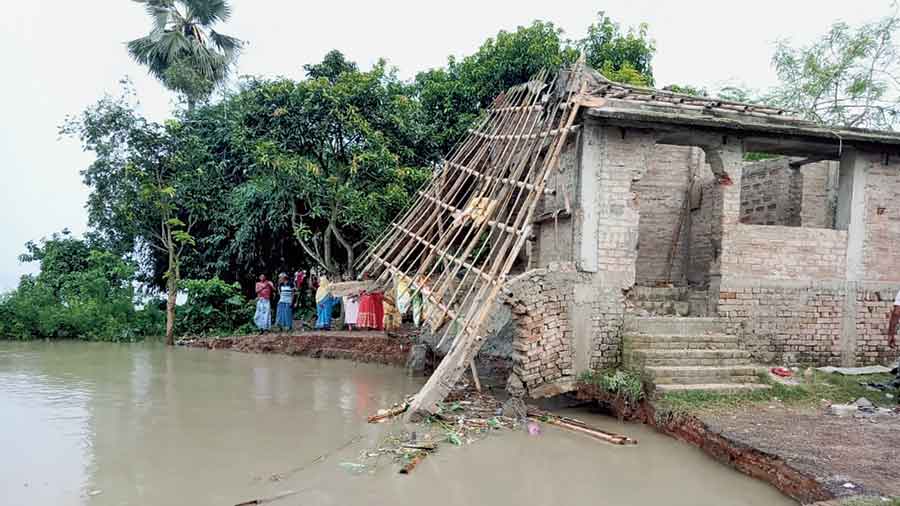 A house destroyed by the erosion of the Ganga’s bank at Pratapganj in Murshidabad district on Tuesday. 
