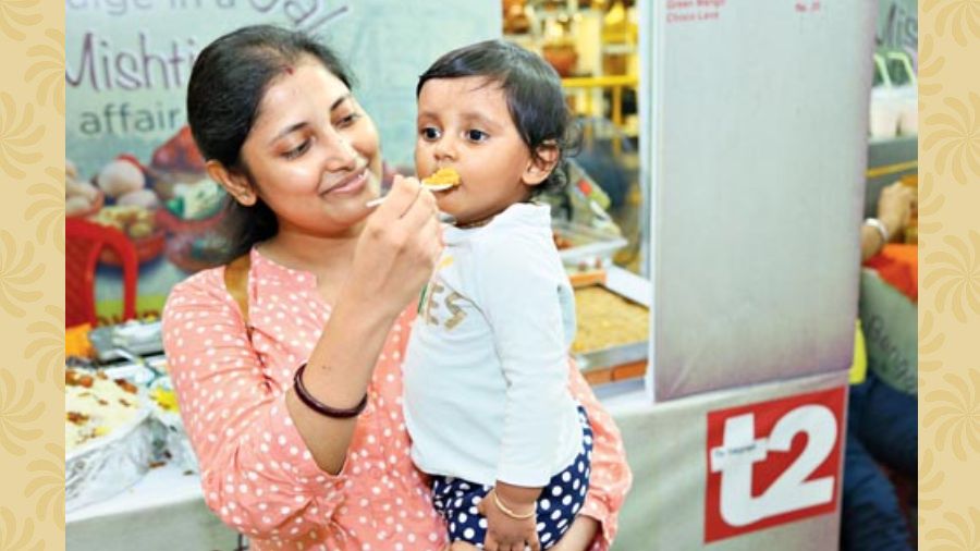 Homemaker Annie Roy was busy feeding her daughter mihidana from Misti Bangla Bardhaman.