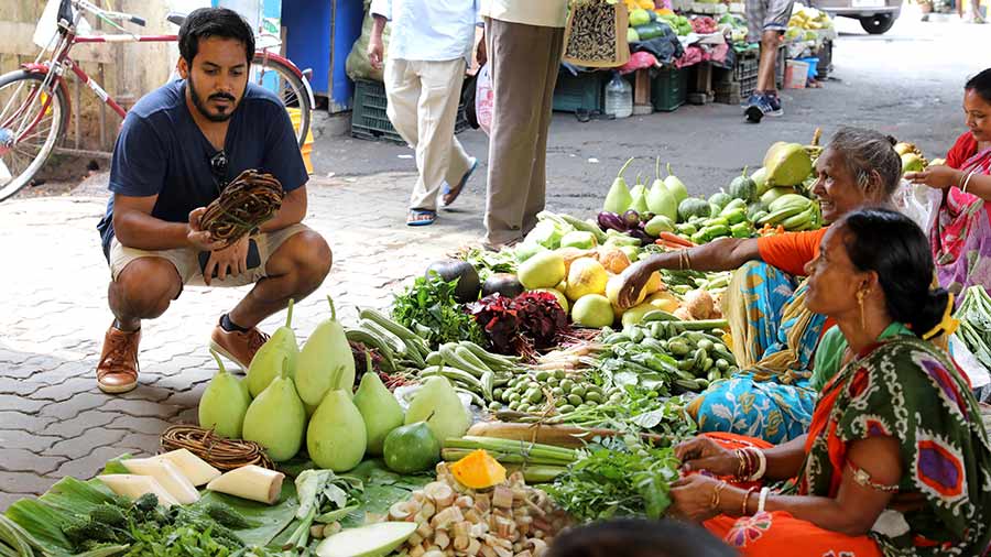 Chef Zac inspects a bundle of ‘kochur loti’ 