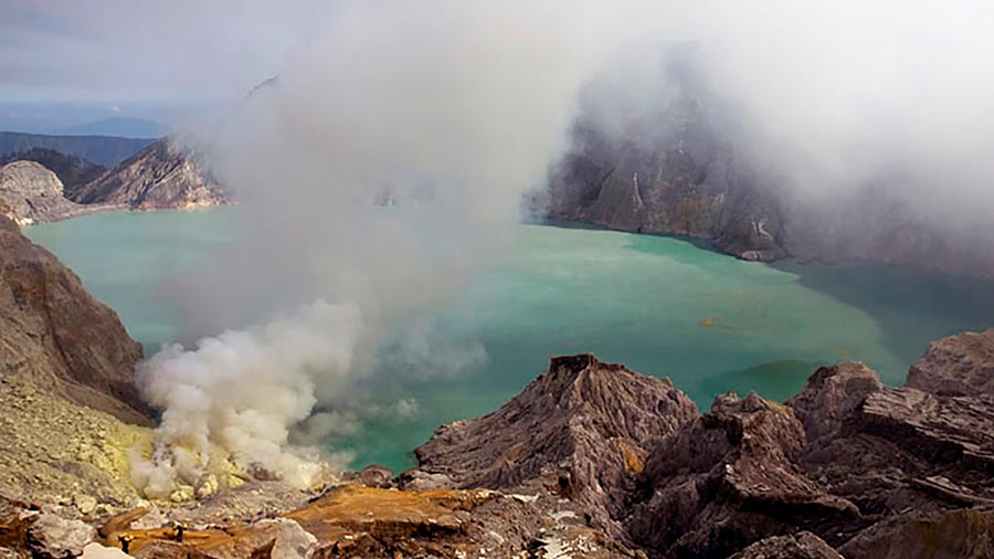 The Kawah Ijen acid lake, enclosed within a volcanic crater in East Java