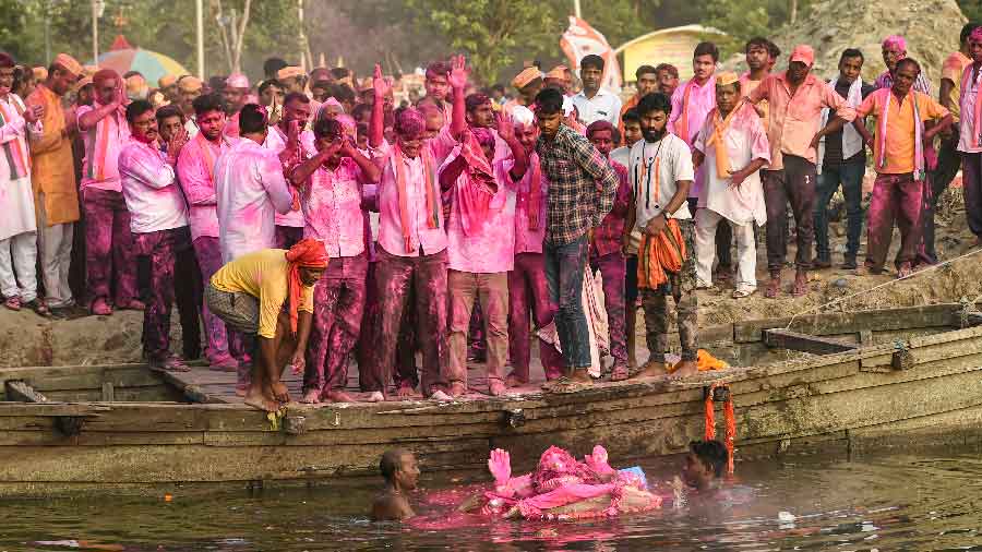 An immersion of an idol in the Gomti river during Gauri Ganpati Visarjan in Lucknow