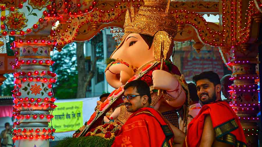 It's all smiles with expectations for next year during immersion procession of Shrimant Dagdusheth Halwai Ganpati in Pune