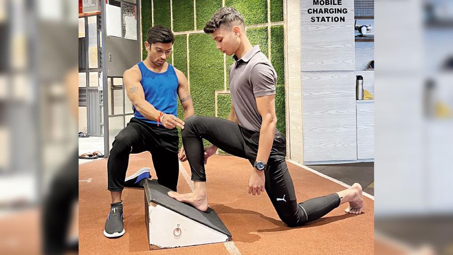 The Soleus (Calf) Stretch on the Ramp. Here, Raj Dutta has fellow trainer Joshua put his foot on the ramp and trying to drive the knee six to 10cm beyond the toes