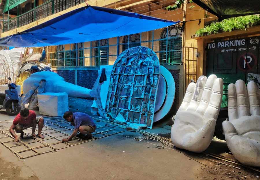 Artisans busy making bamboo structures that will be used to decorate a puja pandal near Girish Park on Thursday, September 8. 