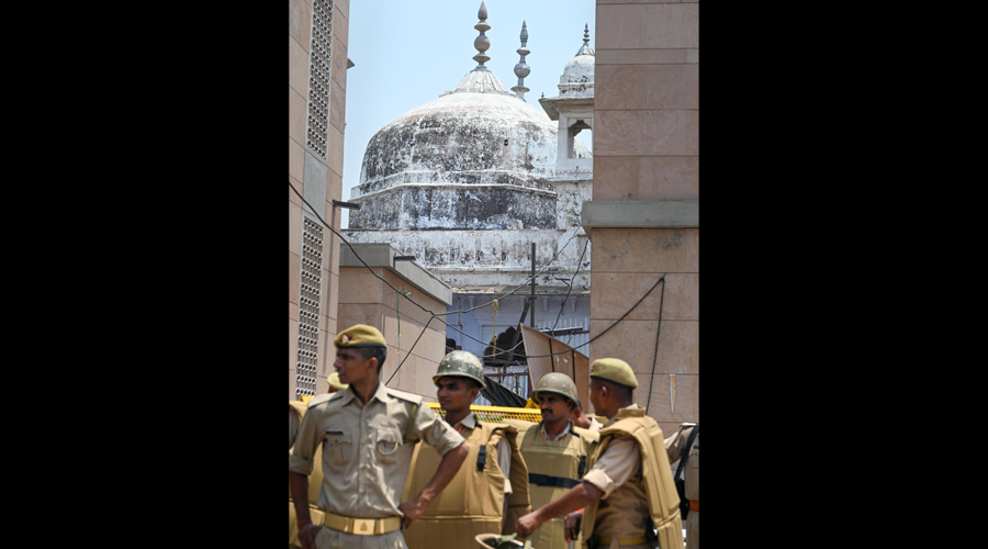 In this Friday, May 27, 2022 file photo security personnel keep vigil during the Friday prayers outside Gyanvapi Masjid in Varanasi. 