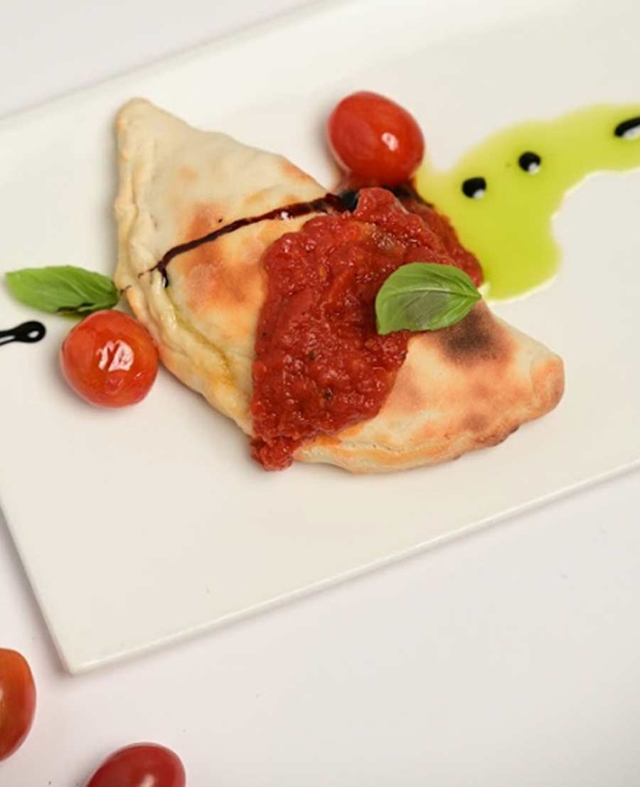 Paired with Folonari Chianti Classico from north Italy, enjoy a warm freshly baked calzone. Made with hand-rolled thin crust dough, pick between the chef’s curated traditional Italian ratatouille or lamb bolognese with mozzarella