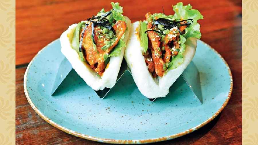 Spicy Cloudy Mushroom Baos: Milky mushrooms are deep-fried and tossed in mayo and chilli paste and served with avocado and pickled cucumber and lettuce. They were the first to introduce this to the city. Rs 280-plus