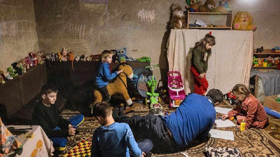 WAR GAMES: Children engage in activities in an underground bunker in a small town south of Kyiv, Ukraine. 