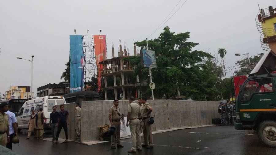 Prison vans and ambulance stationed at the side of the road.