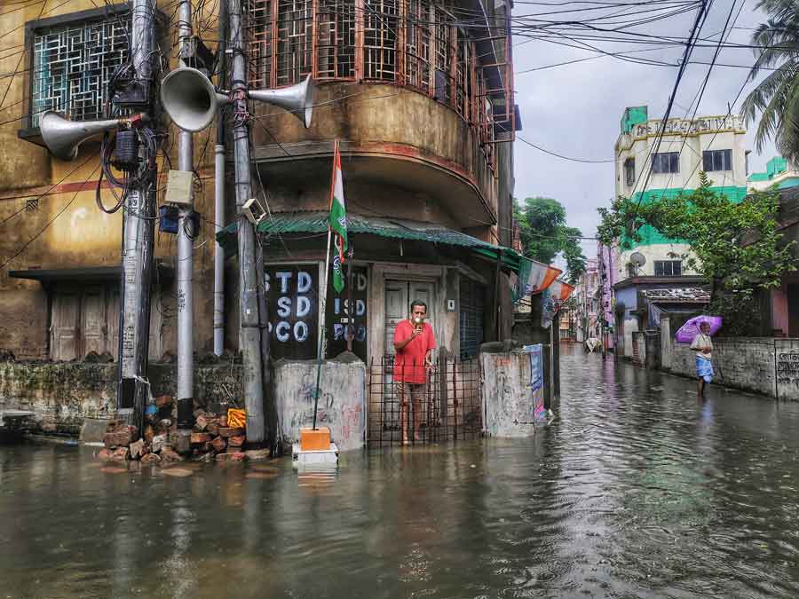 A flooded street in south Kolkata on Tuesday morning. The water started receding in many area as there was no rain after the early hours of Tuesday  
