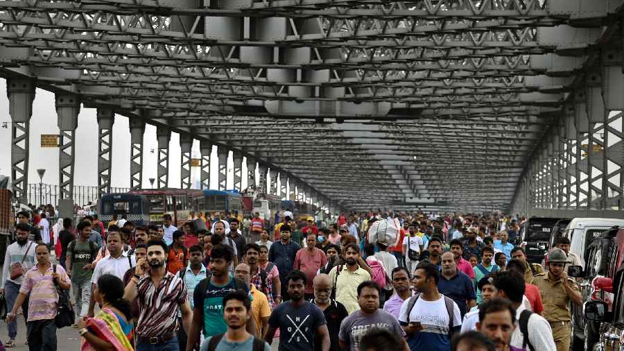 People walk through the Howrah Bridge which was closed due to BJPs protest march