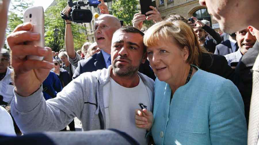 Angela Merkel takes a selfie with a supporter