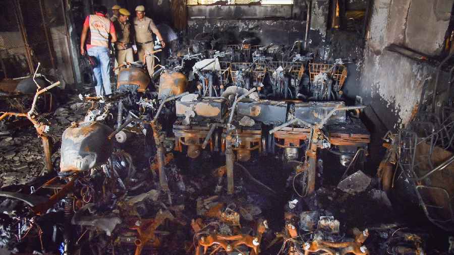 Hyderabad Police and members of their Clues team at the site after a fire broke out in an electric bike showroom on Monday, in Secundrabad