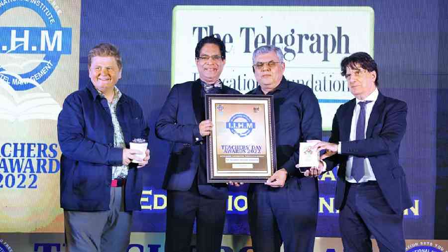 (From left) Paul Walsh, founder, Jungle Crows; Suborno Bose, chief mentor, IIHM; Barry O’Brien, trustee, The Telegraph Education Foundation; Didier Talpain, consul general of France in Calcutta, at the IIHM Teachers’ Day Awards 2022 on Tuesday. O’Brien received an award on behalf of The Telegraph Education Foundation