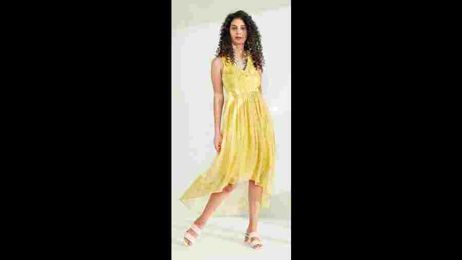 Multipurpose with a capital M, the look is perfect for a brunch with friends, a lunch date or daytime festive wear. The printed georgette dress in a bright yellow tone is detailed with thread and bead embellishment on the yoke.